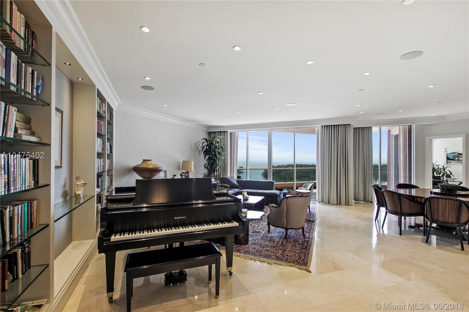 Marvel in the spectacular view of the bay, Miami Beach, Key Biscayne, downtown Miami and Coconut Grove from this renovated 9th floor condo.  Enjoy the exquisite elegant finishes of millwork and details.  Lounge in the master bedroom featuring an oversized walk in closet plus a "night" bathroom. Entertain in the den with a bar area and Plantation shutters for privacy.  The Gables Club boasts 24/7 security with a guard gate, valet, concierge, restaurant, spa, exercise rooms, 4 tennis courts, 2 pools and privacy with elevators arriving in each unit.  A pleasure to show!