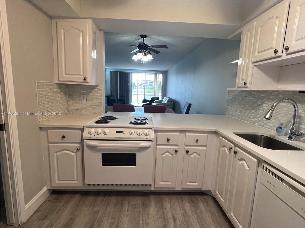 Photo of 2900 N Course Dr #107, Pompano Beach, FL 33069 (MLS # A11465952)