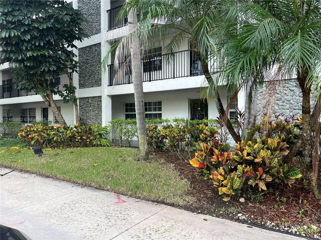Photo of 2900 N Course Dr #107, Pompano Beach, FL 33069 (MLS # A11465952)