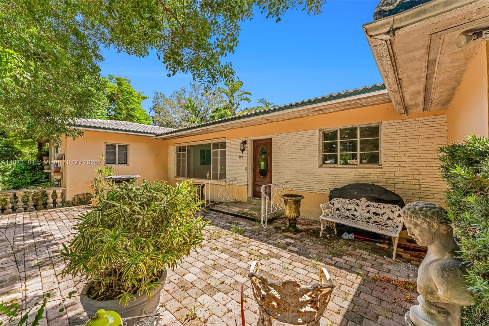 Located near the prestigious Miami Shores Country club, east of Biscayne Blvd just a stone's throw from Biscayne Bay. Oversized corner lot (12,000+sf) on a quiet cul-de-sac street. The home is in near original condition ready to be updated or renovated to make your dream home come true. The split floor plan with 3 large bedrooms and 2 bathrooms has oversized living spaces perfect for entertaining. Lovingly maintained you will find pristine Terrazzo floors, partial impact windows, and a 1 car garage. Private backyard ready to become your tropical oasis. Close to top-rated schools, parks, shopping, dining, golf course, tennis courts, & aquatic center.