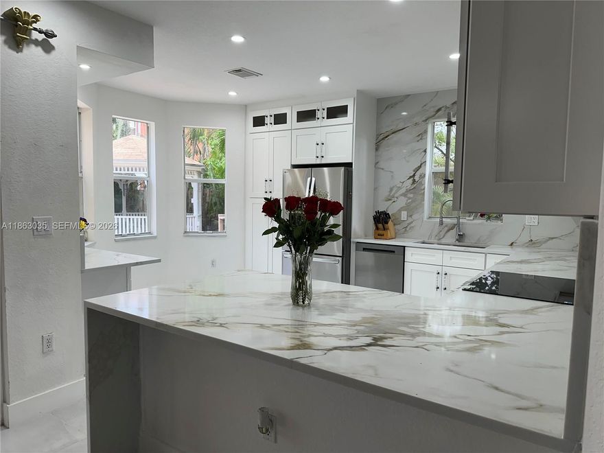 Endless Potential! UPDATED HOME! NEW KITCHEN COMPLETED JANUARY 2026! Perfect for Imaginative Buyer /Investor! This home Features 5/4 with 2 Luxurious Master Suites one with Private Balcony overlooking A Grassy Median (One Guest house / Studio /efficiency) and complete New kitchen with all New appliances - The perfect Prime location Nestled on oversize lot with 2 car garage & Parking for Boat / RV - A Sparkling Pool with New Miami Blue Diamond Bright Color - New Gazebo Roof, This home offers the perfect location for relaxation and the opportunities for generating substantial income from guest house / multiple efficiency units at the same time. Perfect Blend of comfort, elegance, functionality and Investment potential. Chandelier and entrance is not included in the sale. Home insurance cost $4619.