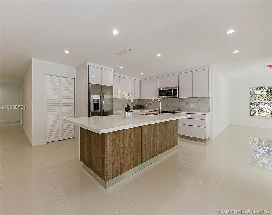 Remodeled and move-in ready family home in a fantastic neighborhood east of Old Cutler near Deering Estate. Situated on a 19k lot, this home features 4 bds each with en-suite bathrooms, high impact windows/ doors throughout, open concept kitchen and family room overlooking the pool and patio area, plus 2-car garage.  Great school district- Coral Reef, Southwood, and Palmetto High This home features a new colonial exterior with a modern interior that has created a look that's contemporary yet classic.