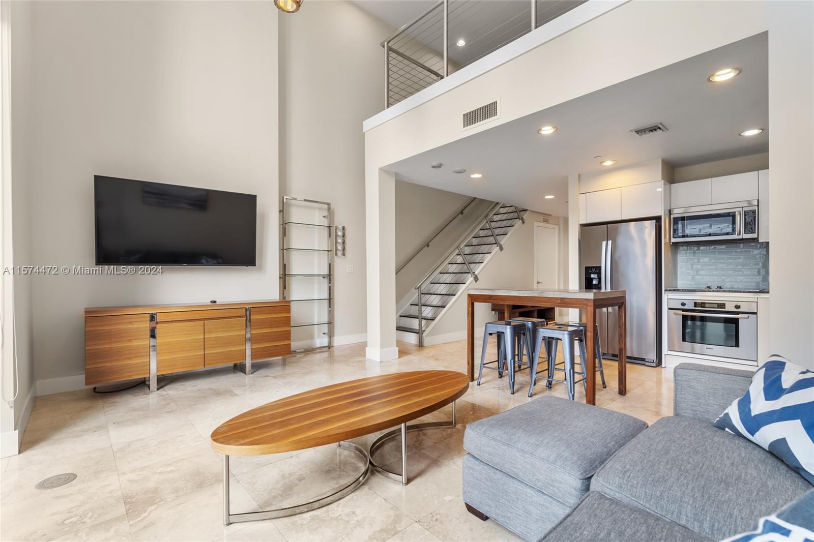 Live at the heart of the action! Amazing two story floor plan with spacious living area, double height ceiling, nice den upstairs that can be used for an office! 1050 Brickell offers a variety of amenities such as gym, swimming pool, billiard, mini golf, cigar room, party room.... This is an incredible apartament, must see to appreciate!