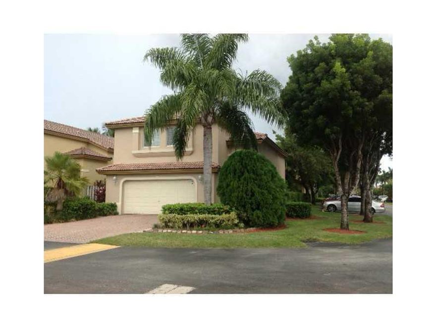 Enjoy quiet living in this delightful and attractive single family home at Doral Landing East. A gated community. This spacious home has 4 bedrooms, 2.5 baths  with a remodeled kitchen in which stainless steel appliances and wood cabinets are part of the  beautiful updates of this home. A big covered patio with barbecue is part of the outdoors recreation. Kids playground, Plenty of guest parking space.