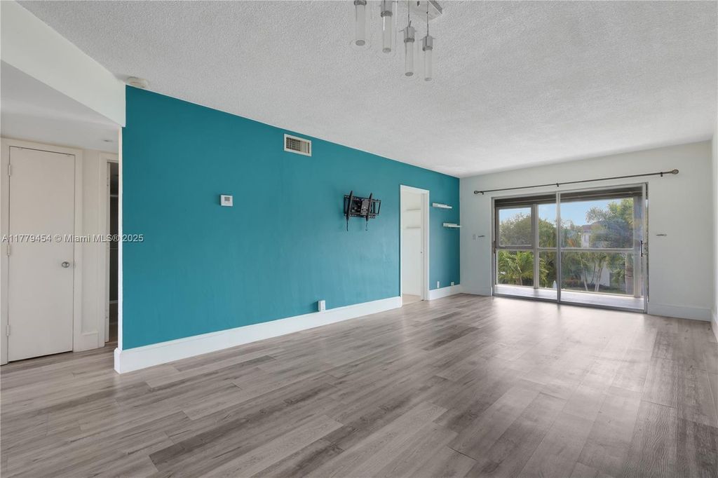 Photo of 4200 Crystal Lake Dr #303, Deerfield Beach, FL 33064 (MLS # A11779454)