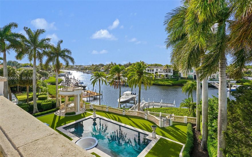 This extraordinary estate at 370 Eagle Drive feels like a Beverly Hills or Palm Beach mansion brought to Admirals Cove. Set on approximately 0.65 acres — significantly larger than most homesites in the community — the property also features over 14,000 square feet under air conditioning, creating an estate-sized feel that is almost impossible to replicate in Jupiter's luxury waterfront market. From the moment you arrive, the property makes a statement with dramatic architecture, expansive living spaces, and a layout designed for both large-scale entertaining and comfortable everyday living. Inside, the home features a private theater, grand entertaining areas, and an atmosphere that feels more like a private resort than a traditional residence. The outdoor living experience is equally