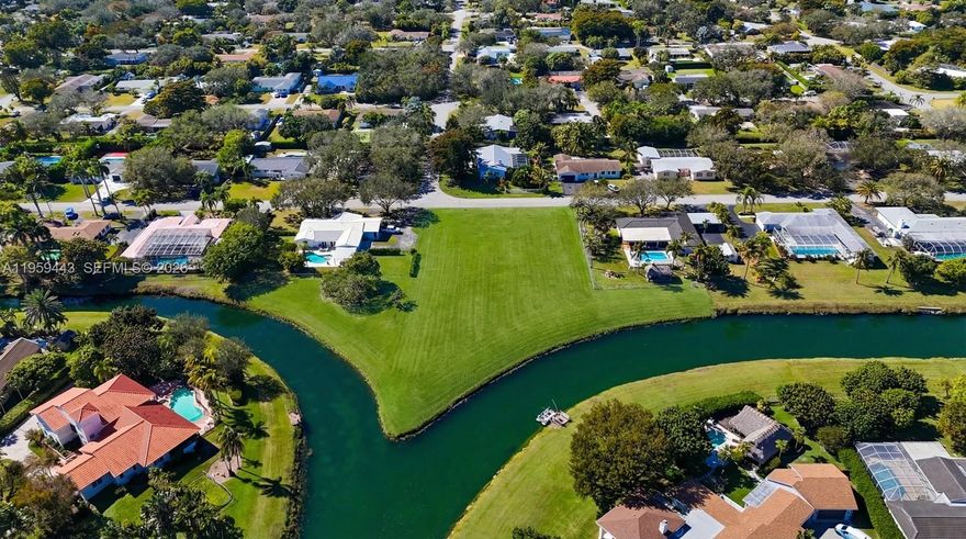 Located in one of South Florida’s most sought-after communities, this one-of-a-kind Palmetto Bay lot is the perfect canvas for someone ready to build their dream home. Positioned at the intersection of two canals, it offers wide, unobstructed water views and exceptional privacy with no rear neighbors. With over half an acre of estate-zoned land, this property delivers the space, serenity, and setting end-users look for but rarely find.
