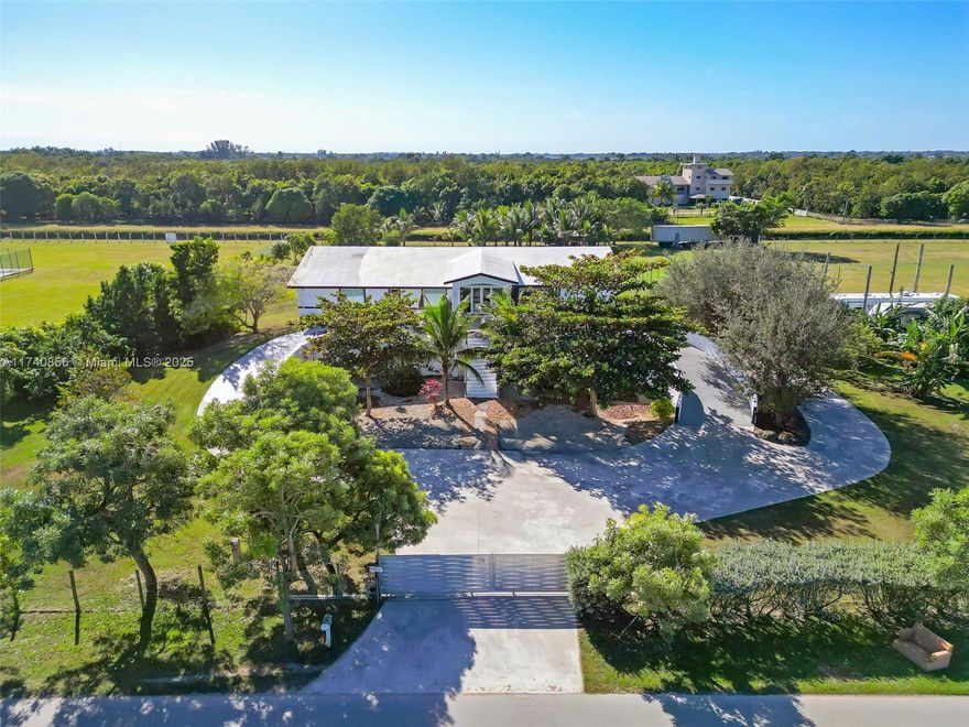 Discover the ultimate self-sustainable sanctuary located in the highly sought after Redlands community, a 2019-built, this Redlands estate spans nearly 4 lush acres. Perfectly blending luxury and resilience, built to sustain the strongest of hurricanes and any natural disaster, features 6 bedrooms, 6 bathrooms, and a state-of-the-art underground bunker with space for up to 18 cars, perfect for an elite prepper’s haven.
The property is powered by 60 solar panels with a 20KW battery backup and includes multiple EV charging stations, fertile land for farming, and thriving fruit trees. Designed for sustainability and privacy, enjoy nearby horse trails, the tranquil C-102 canal, and resort-style living. A rare opportunity to secure luxury, safety, and independence in one extraordinary package!