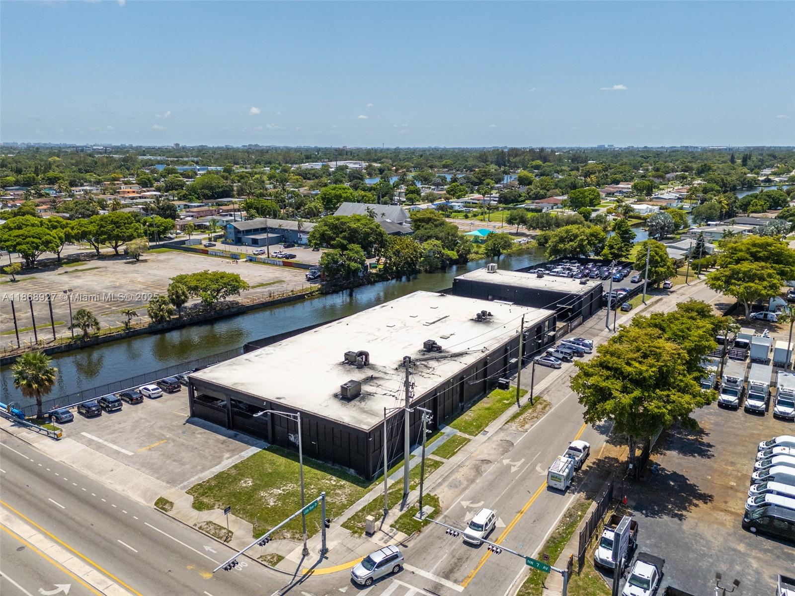 This 28,782 SF showroom/warehouse is situated on a gated 1.81-acre lot and is zoned UC-MCS, permitting a wide range of uses including dealership,EV center, civic, or future mixed-use development. The property is configured as a luxury auto dealership and includes a dealer license along with approved plans for a state-of-the-art facility. Key features include 18+ foot clear heights, multiple private offices, gated parking, and more than $2 million in recent capital improvements, including new HVAC, plumbing, electrical windows, doors, restrooms, and resurfaced parking. Positioned on a highly visible corner within the NW 7th Avenue CRA, the property benefits from proximity to multi-billion-dollar developments and eligibility for TIF and related growth incentives. Delivered vacant at closing.