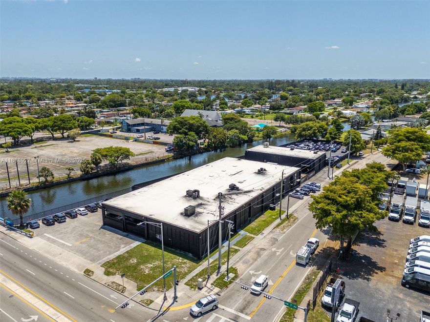 This 28,782 SF showroom/warehouse is situated on a gated 1.81-acre lot and is zoned UC-MCS, permitting a wide range of uses including dealership,EV center, civic, or future mixed-use development. The property is configured as a luxury auto dealership and includes a dealer license along with approved plans for a state-of-the-art facility. Key features include 18+ foot clear heights, multiple private offices, gated parking, and more than $2 million in recent capital improvements, including new HVAC, plumbing, electrical windows, doors, restrooms, and resurfaced parking. Positioned on a highly visible corner within the NW 7th Avenue CRA, the property benefits from proximity to multi-billion-dollar developments and eligibility for TIF and related growth incentives. Delivered vacant at closing.