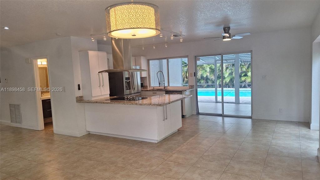 Photo of 1575 NE 38th St, Oakland Park, FL 33334 (MLS # A11898458)