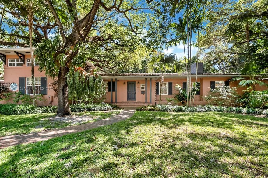 Nestled beneath a lush canopy of mature trees on a tranquil cul-de-sac in the coveted Utopia Homeowners Security Association, this South Grove gem offers endless potential. This is an A+ Coconut Grove location with tons of privacy. Bright, spacious living areas feature warm wood and authentic saltillo floors, a romantic fireplace, and expansive impact glass doors that seamlessly blend indoor and outdoor spaces. The oversized lot is a tropical oasis with lush gardens, a sprawling lap pool, and an open terrace — perfect for creating your very own private retreat. With updated electrical, plumbing, and a 9-year-old tile roof, this is an ideal opportunity to renovate, reimagine, or rebuild. Enjoy Coconut Grove’s parks, marinas, fine schools, and vibrant village life just a stroll away.