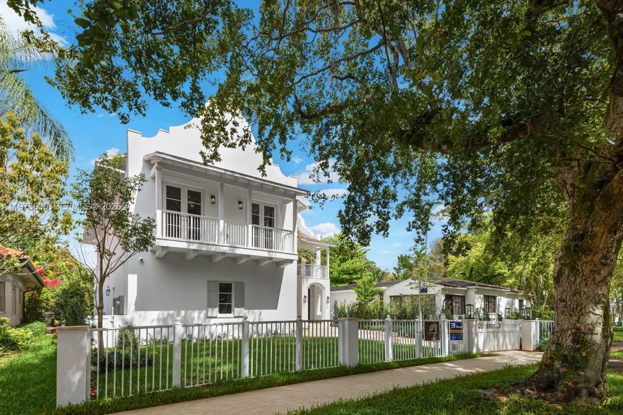 Exquisite modern Dutch–Caribbean masterpiece offering the perfect blend of architectural sophistication and relaxed luxury living. Secured motor court entry with a two-car garage welcomes you into this spectacular two-story residence featuring 4 bedrooms, 5.5 baths, and a dedicated ground-level office (also serves as bedroom with ensuite bathroom).
Designed by award-winning Locus Architecture, the home showcases dramatic scale and seamless indoor-outdoor flow. Expansive living spaces featuring a mud room,  20ft ceilings, wine cooler bar and open spaces to a covered kitchen and summer entertaining area overlooking a stunning pool deck ideal for hosting or everyday family living.
Every bedroom features its own private covered balcony, ensuite bathroom and walk-in closet creating serene retreats throughout and comfortable living.
The chef’s kitchen is fully outfitted with top-of-the-line Sub-Zero, Cove and Wolf appliances, complemented by custom cabinetry by Mia Cucina throughout the home, delivering exceptional craftsmanship and refined detail at every turn.
A rare offering combining architectural pedigree, premium finishes, and effortless elegance.