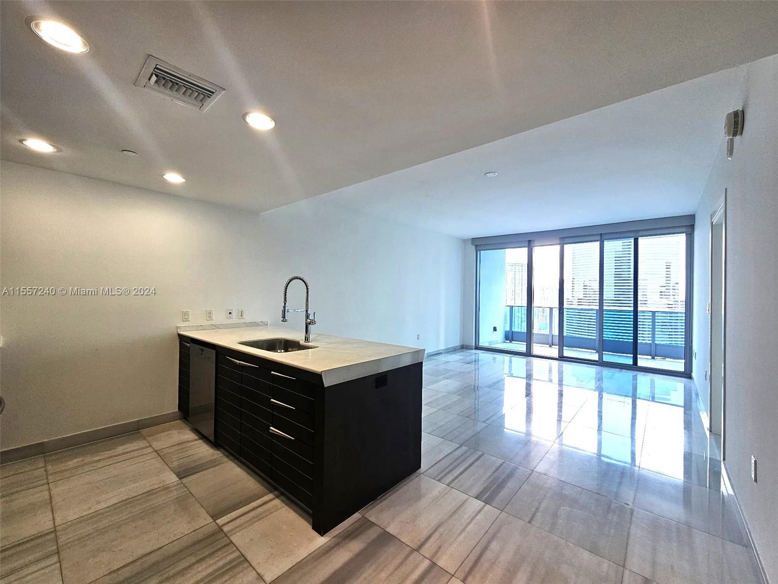 Exquisite apartment at EPIC-Luxury State of the Art Building. Located where the Miami River meets the Bay in downtown Miami. Enjoy this oversized 1 Bedroom with 1.5 Bathrooms, 5 Star amenities, and a breathtaking city view. Snaidero "Time" Cabinetry, marble countertops, very nice flooring in kitchen, dining, and bedroom. Italian marble in the bathroom, Rustic travertine in balcony. Blackout curtains and Light Shades. Rent includes basic cable and internet.