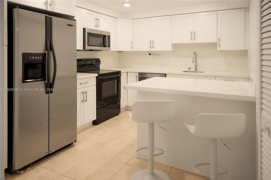 BEAUTIFUL SPLIT BEDROOM FLOOR PLAN APARTMENT IN THE DESIRABLE COUNTRY CLUB VILLAGE IN WESTON! THIS 1,235 ADJ. SF OF LIVING SPACE UNIT FEATURES 2 BEDROOMS, 2 1/2BATHROOMS, A REMODELED KITCHEN WITH WHITE QUARTZ COUNTERTOPS, MODERN CABINETS, STAINLESS STEEL FRIDGE, MICROWAVE, DISHWASHER, WASHER/DRYER, PORCELAIN FLOORING THROUGHOUT, UPDATED BATHROOMS, RECESSED LIGHTING,  ACCORDION SHUTTERS, LARGE SCREENED BALCONY  WITH SERENE VIEWS FOR ENTERTAINMENT. ALSO, THE BUILDING OFFERS A SECURE ENTRANCE WITH LOCKED LOBBY PROVIDING PRIVACY AND SAFETY FOR ALL RESIDENTS. PRIME LOCATION NEAR TO WESTON TOWN CENTER, PARKS, A-RATED SCHOOLS, MAJOR EXPRESSWAYS. YEARLY REQUIRE MEMBERSHIP TO THE BONAVENTURE TOWN CENTER WITH A STATE-OF-THE-ART THEATER, GYM, POOLS, TENNIS/BASKETBALL COURTS, SKATING RINK, AND MORE!!