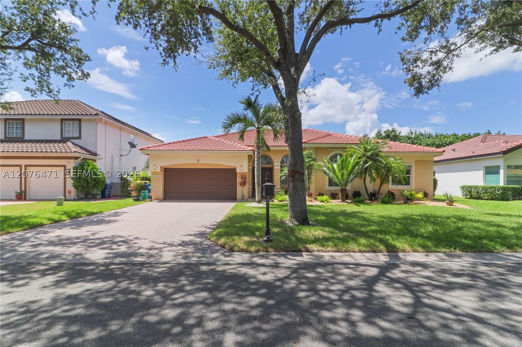 Photo of 10256 NW 53rd Ct, Coral Springs, FL 33076 (MLS # A12076471)