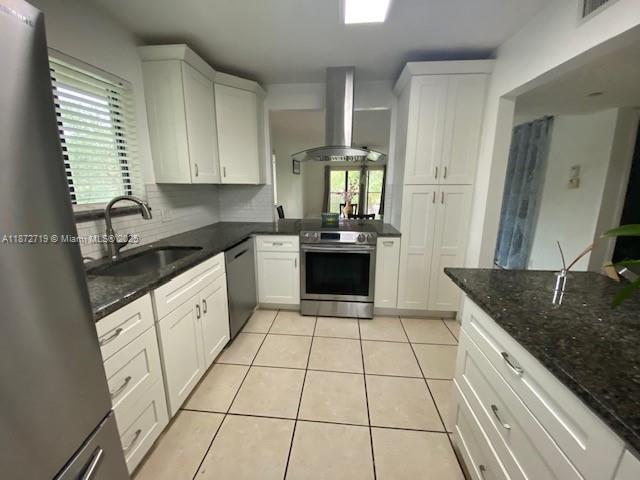 Substantially renovated 2/2 corner unit at Racquet Club in prestigious Weston where living and landscaping is upscale with a safe serene environment. Updated Kitchen with SS appliances and Hood System! Updated bathrooms. Full size Washer and Dryer in separate space, not inside bathroom and kitchen. View of pool area and garden from 2nd fl. Reserved parking in front of building. Great school district! Walk and bike ride around the lush surroundings. Membership to Bonaventure Town Center Club with all amenities - club, new gym, remodeled pool, hair salon, tennis and pickelball courts, dance, exercise rooms, basketball court, bowling alley, movie theatre, etc. Association fees include insurance and other expenses. Association approval required. Take a look and make an offer!