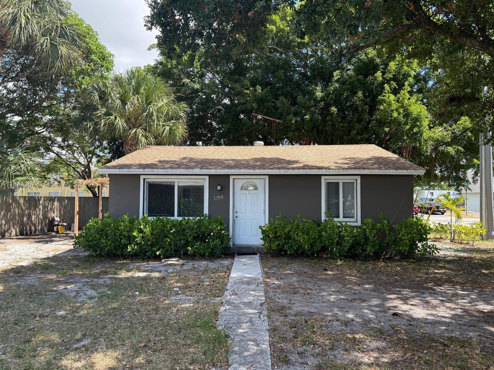 Beautiful corner home in quiet neighborhood. Features 2 bedrooms and 1 bathroom, freshly painted, updated bathroom and kitchen, tile floors throughout. Large yard .