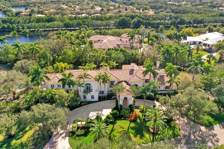 Absolutely MAGNIFICENT LAKEFRONT ESTATE on 2.03 Acres located in the most desirable section of the prestigious Windmill Ranch Estates! First time on the market this Gallagher custom built home has only the finest of details, finishes & craftsmanship. Features include: Grand circular driveway with porte cochere, vast amount of parking & 4 car garage with side entry, 6 bedrooms, 7 baths & 2 half baths, library/office, living rm with soaring ceilings & fireplace, family rm with gorgeous fish tank & built-ins, ultimate chef's kitchen with huge pantry, billiard rm with bar & fireplace, elevator, loft/2nd office, oversized master suite with fireplace & exercise room, guest house & so much more encompassed by stunning Vizcaya like gardens & grounds. Impact glass! Truly one-of-a-kind masterpiece!