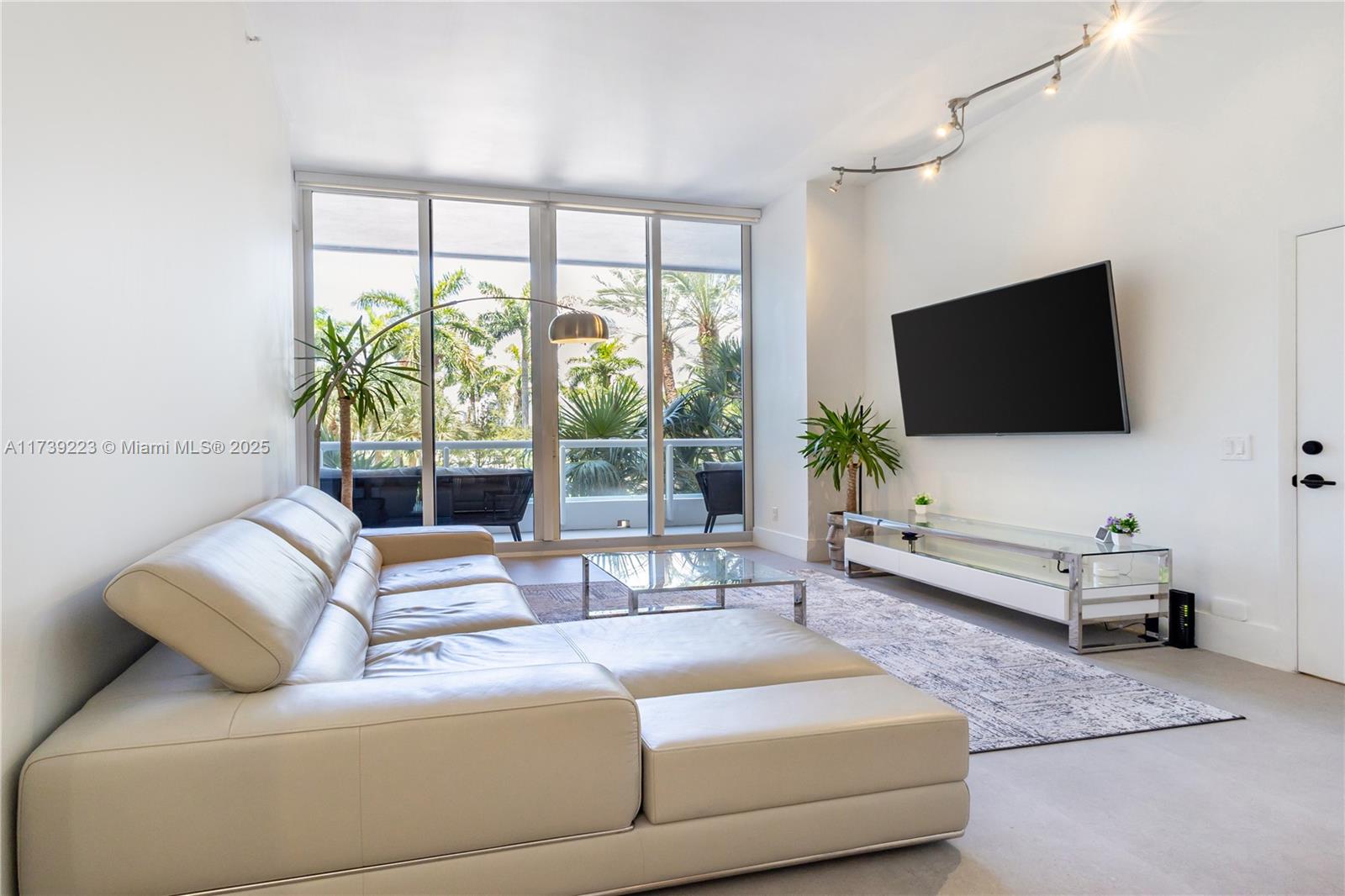 Step into timeless sophistication at The Point of Aventura. This fully renovated 2BD/2BA loft-style home features 12-ft ceilings, floor-to-ceiling glass, and a lush marina-view terrace. Over $20K in upgrades, including motorized blinds for serene privacy. The chef’s kitchen stuns with quartz counters, marble backsplash, SS appliances, beverage fridge, and dual pantries. 24x48 porcelain floors, custom closets, Nest A/C, and private laundry complete the experience. Luxury amenities: spa, gym, 4 tennis courts, café, marina, playground. Near top schools, dining, shops, and beach. EV-ready. $24K assessment paid by seller.