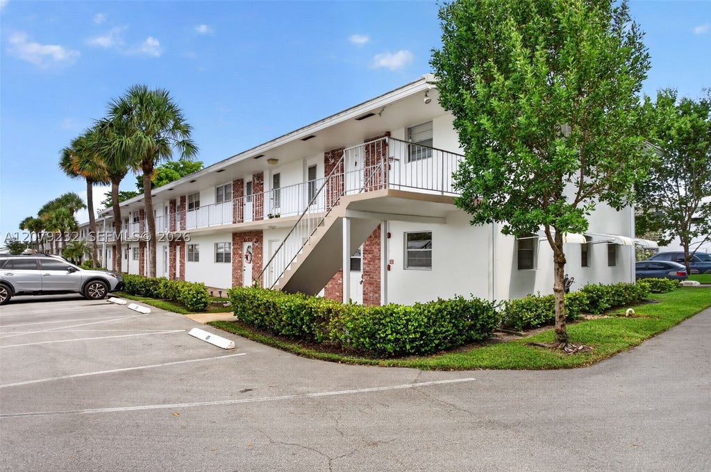 Photo of 2551 W Golf Blvd #101, Pompano Beach, FL 33064 (MLS # A12079232)