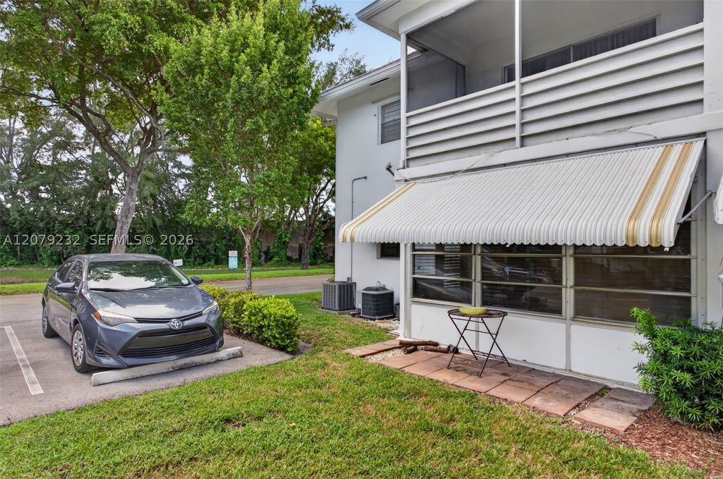Photo of 2551 W Golf Blvd #101, Pompano Beach, FL 33064 (MLS # A12079232)