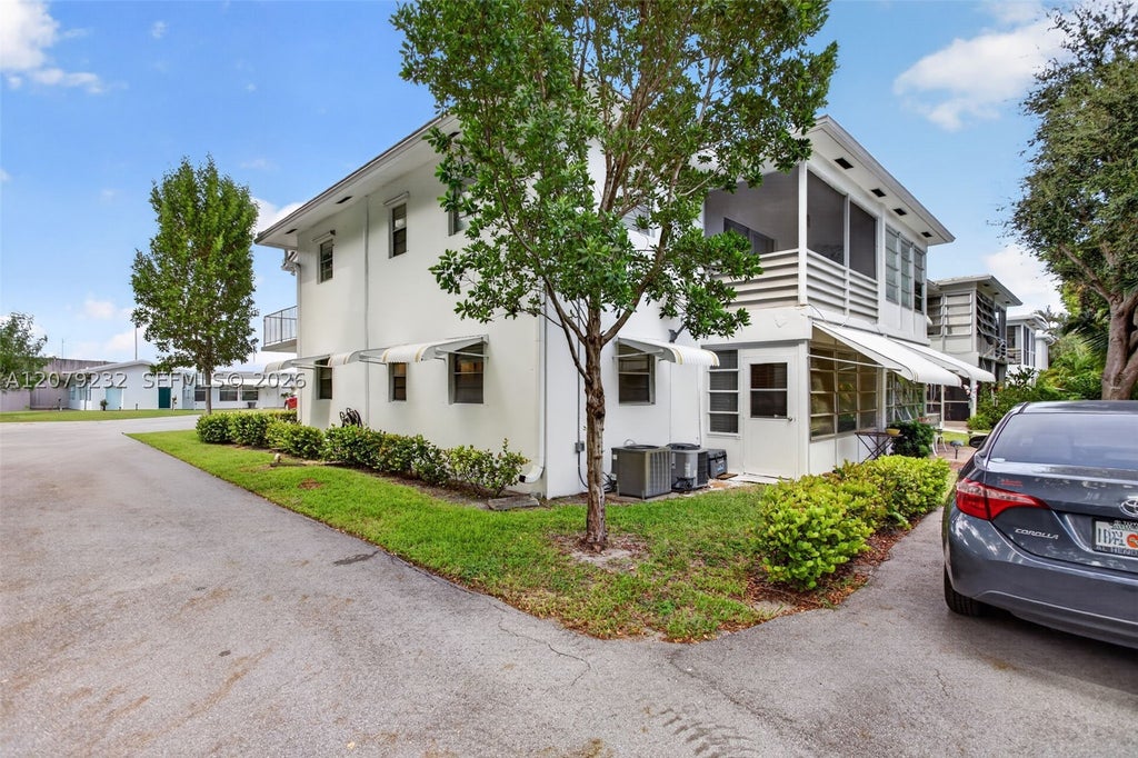 Photo of 2551 W Golf Blvd #101, Pompano Beach, FL 33064 (MLS # A12079232)