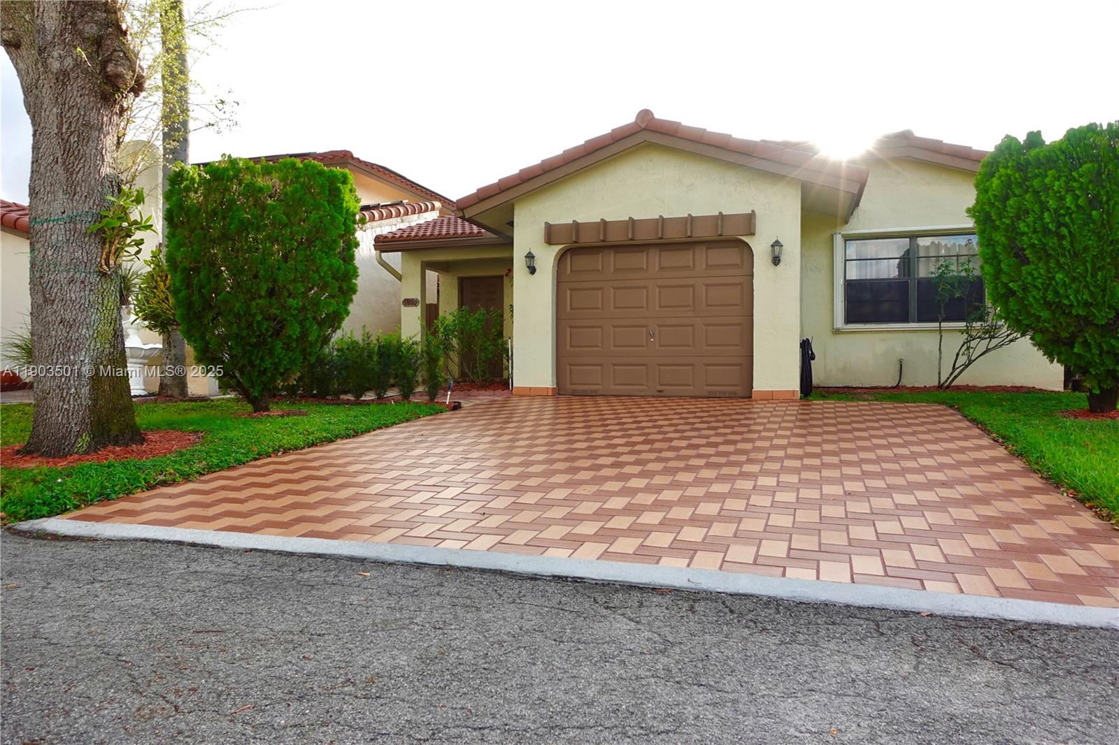 Beautifully updated townhome in a prime central location!  Quiet neighborhood just 7 miles away from I-95.  Features tile/marble floors, remodeled kitchen and bathrooms, and 250 sq ft of added living area.  Gated community with pool, gym, tennis court and clubhouse.  HOA is $291/month and includes lawn care, exterior paint, basic TV and high-speed internet. A/C 2024.  Furniture is available for sale.  Near schools, hospitals and shopping!
