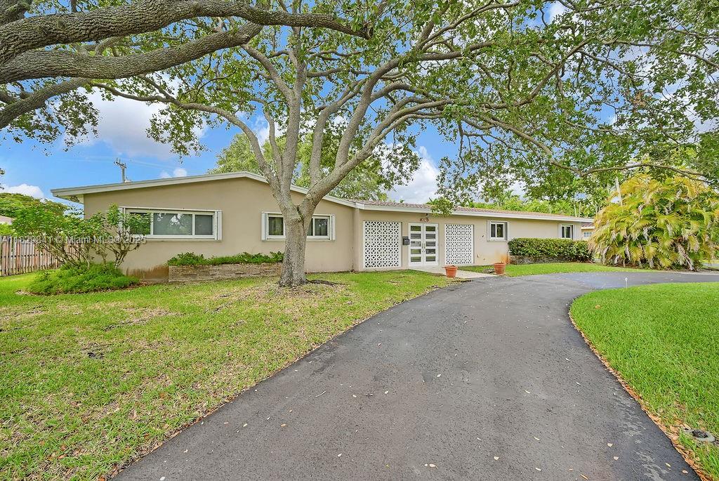Welcome to this North Palmetto bay rental, available for short term (6 months) or annual lease. This 3/2 sits on a quiet street with an expansive lot. Enjoy the yard from the comfort of a large screened courtyard, perfect for in/outdoor living. Plenty of storage in a two car garage with a workshop area that can be used as an office, gym, play area, or extra storage. Circular driveway allows for ample parking. This well-maintained mid-century modern home is conveniently located near Coral Reef Park, A schools, The Falls, and 5 blocks south of Pinecrest.