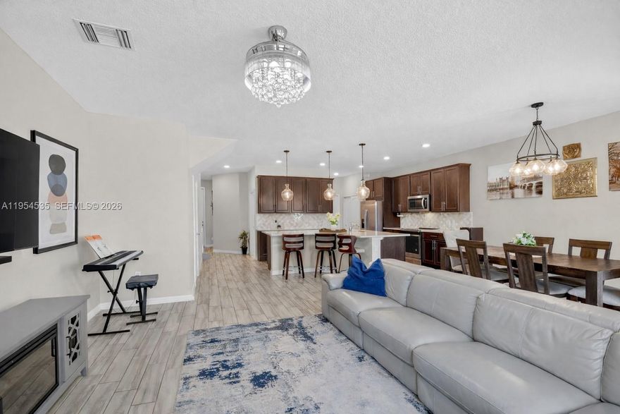 Gorgeous Luxury Townhome in the Highly Sought-After, PET-FRIENDLY, GATED Community of THE FIELDS AT LAKE WORTH by DiVosta Homes. This NEWER-CONSTRUCTION, Two-Story Residence Offers 3 Bedrooms, 2.5 Bathrooms, a 2-CAR GARAGE, EXTENDED DRIVEWAY, and Nearly 1,900 SQ FT of Refined Living Space with IMPACT WINDOWS AND DOORS Throughout.

The Open-Concept Main Level Features Expansive Living and Dining Areas and a Modern Kitchen Highlighted by a LARGE ISLAND IDEAL FOR ENTERTAINING, Sleek Countertops, Stainless Steel Appliances, and Generous Storage. Upstairs, the Primary Suite Is a Private Retreat Offering a WALK-IN CLOSET, FLEX SPACE IDEAL FOR A HOME OFFICE OR SITTING AREA, and a SPA-INSPIRED ENSUITE BATH WITH DUAL SINKS AND WALK-IN SHOWER. Two Well-Appointed Guest Bedrooms, a Full Bath, and a Convenient Laundry Area Complete the Upper Level.

Enjoy a RESORT-INSPIRED LIFESTYLE with Convenient Access to Exceptional Community Amenities, Including a Sparkling Pool Area, Elegant Clubhouse, STATE-OF-THE-ART FITNESS CENTER, Tennis and Basketball Courts, Playgrounds, and Beautifully Maintained Green Spaces.

Ideally Located Near TOP-RATED SCHOOLS, Parks, Shopping, Dining, MAJOR HIGHWAYS, and AIRPORTS. Schedule Your Private Tour Today and Experience ELEVATED COMMUNITY LIVING at Its Finest.