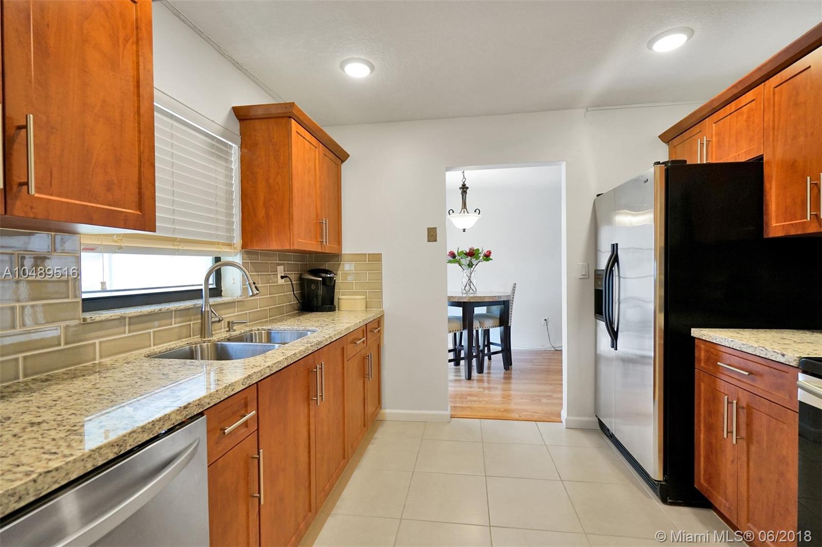 Back on the market. Two story townhouse in a private cul-de-sac located in the coveted family friendly Lakes of Acadia. This 4 bedroom 2 upgraded bathrooms has been kept in immaculate condition. One bedroom is located down stairs with a full bathroom. Meticulously upgraded galley kitchen with granite countertops and stainless steel appliances. New capet. Separate laundry room large enough to hold a top load washer and dryer. Huge backyard perfect for any family occasion. Neatly manicured landscaping. Great starter home that is conveniently located minutes away from the Florida turnpike, 826, and I-95.