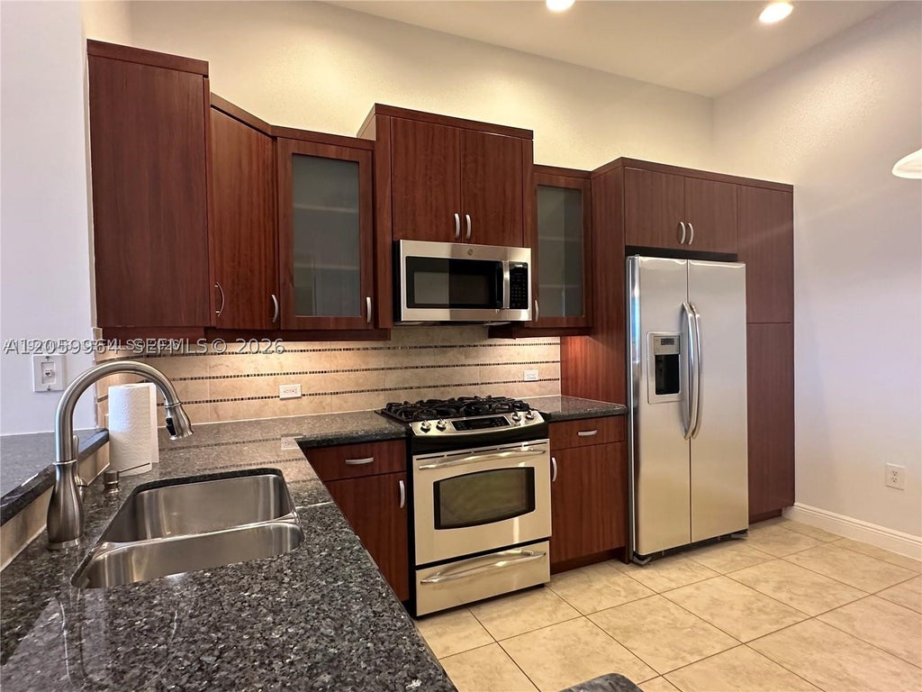 Photo of 3055 NW 126th Ave #411, Sunrise, FL 33323 (MLS # A12059964)