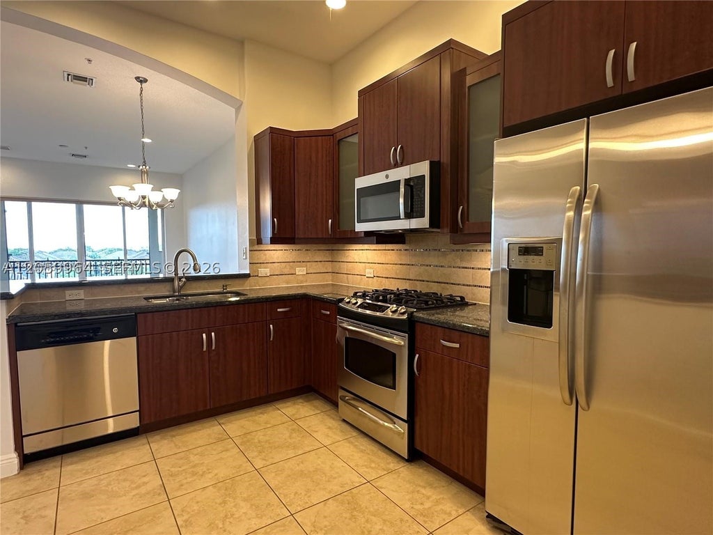 Photo of 3055 NW 126th Ave #411, Sunrise, FL 33323 (MLS # A12059964)
