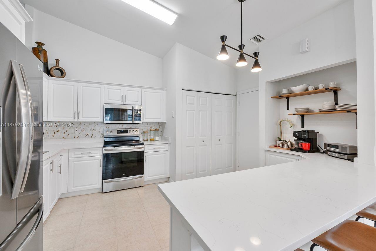 BEST VALUE in Floral Lakes! You will want to call this one HOME! All updated and has everything you want. This bright & open 3-bedroom, 2-bath home features a 2024 roof, 2 yr old kitchen with white refaced cabinets, quartz counters, a cozy coffee nook and lots of cabinets for storage. The primary bath is tastefully updated with a huge walk-in closet. The 2nd bathroom is updated with a new vanity and granite countertop, tub and walls have been resurfaced. Water heater is 1.5 yrs, AC is 5 yrs, all new window treatments and full accordion shutters for peace of mind. Pet friendly, 2 up to 40 lbs ea. Comfort, style, and security in this 55+, sought-after community, close to dining, shopping, and beaches. Enjoy tennis courts, pool, pickleball, an active card room, clubs, shows, and so much more.