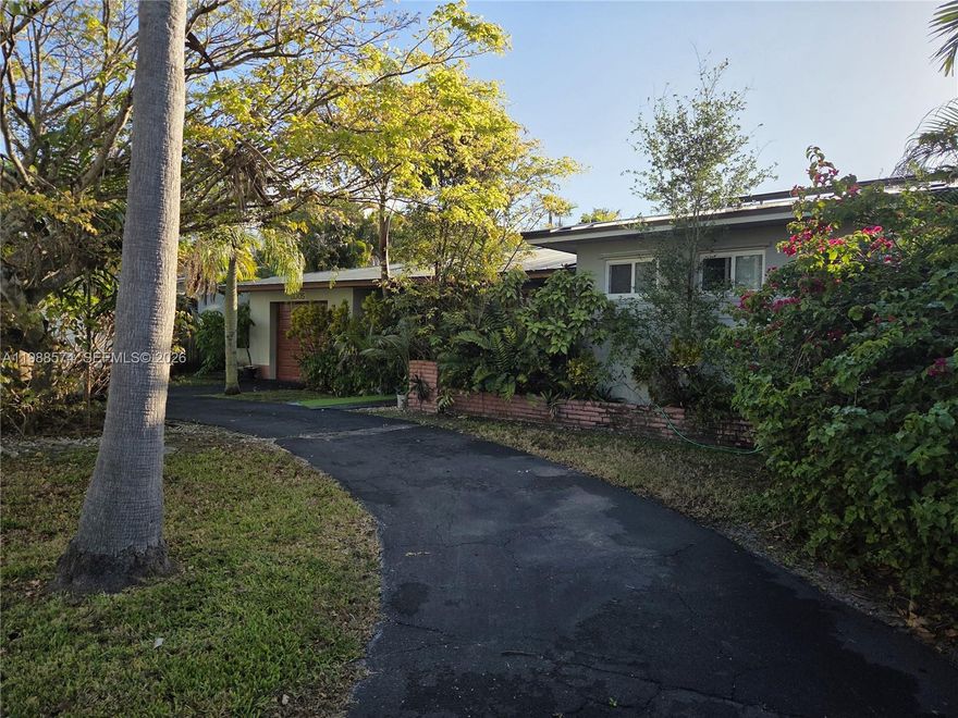 Nestled on a quiet, private street in desirable South Miami, 6005 SW 64th Place offers comfort, privacy, and thoughtful upgrades throughout. This 3-bedroom, 2-bath residence features 2,418 square feet of living area, plus a separate office that could easily be converted into a 4th bedroom, providing added flexibility for guests, family, or working from home.

The home is enhanced with valuable improvements including a metal roof, impact windows, and solar panels for added efficiency, durability, and peace of mind. Inside and out, the property is designed for both everyday living and entertaining, with jacuzzi connections already in place and a private backyard framed by palm trees that create a tranquil, tropical setting.

Additional highlights include a 1-car garage and a layout that combines function with comfort in a highly sought-after location. Adding to its appeal, the property is located near highly regarded schools, including South Miami K-8 Center’s Expressive Arts Magnet program and South Miami Senior High’s Magnet School for the Arts.