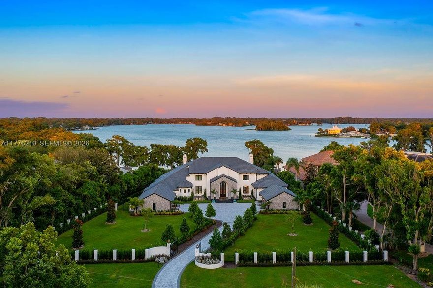 Lakefront estate featuring 6 bed, 7 full and 3 half baths. over 11,000 SqFt on 2,7 acres. Resort-style pool, summer kitchen, 6-car garage, fully fenced with a private gate. 120 feet of lake front on Winter Park Chain of Lakes, private boat dock, and boat lift. All bedrooms with en-suite bathrooms, fireplace, sauna, fitness room, office room, and expansive walk-in closets. Lutron system, crystal chandelier, marble and wood floors, dual soaring staircase, private elevator.