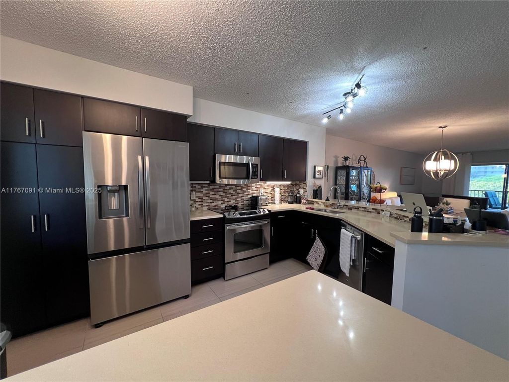 Photo of 2240 N Cypress Bend Dr #506, Pompano Beach, FL 33069 (MLS # A11767091)