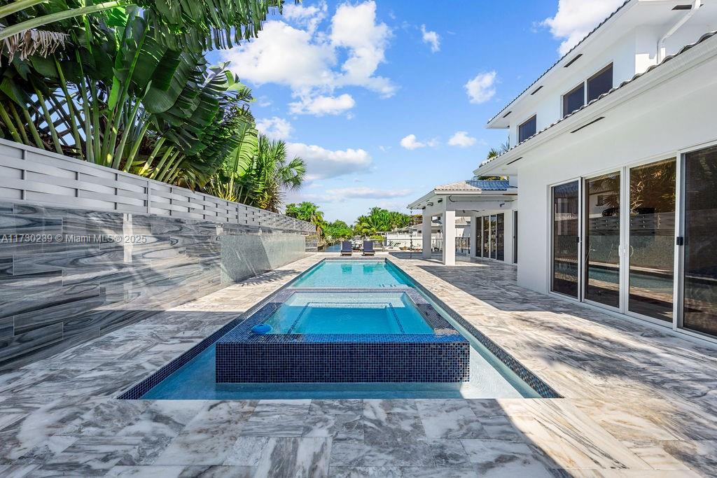 Incredible Waterfront Home – Now $1,980,000!
Step into luxury in this stunning 4-bed, 4-bath new construction in a vibrant boater’s community. Enjoy an outdoor kitchen, expansive patio, and a beautiful pool with breathtaking open ocean access canal views. The lot accommodates a 40-ft RV or in-law quarters, ideal for multi-generational living. Stay secure with a private fence and enjoy modern amenities like new A/C and a tankless water heater. Minutes from beaches, shopping, the airport, and Port Everglades, this rare waterfront gem won’t last long. Schedule your showing today!