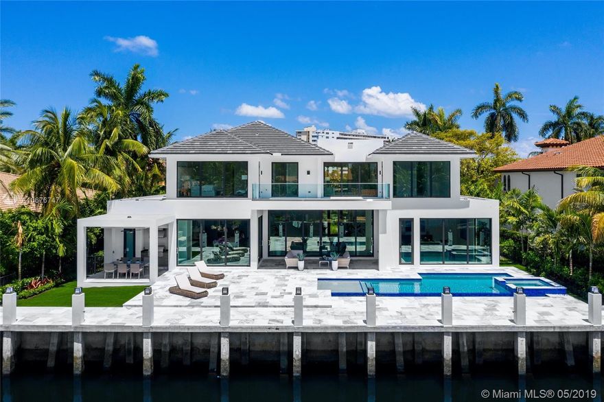 Located on the highly coveted Royal Plaza Drive, this stunning modern home boasts impeccable features like floor to ceiling windows, incredible balcony depth, sleek stylish kitchen, a 3 car garage and 100 ft of water frontage. This contemporary home floor plan encompasses 5 spacious bedrooms 6.2 luxe bathrooms with stylish edge. Never been lived in ready to welcome its first family.