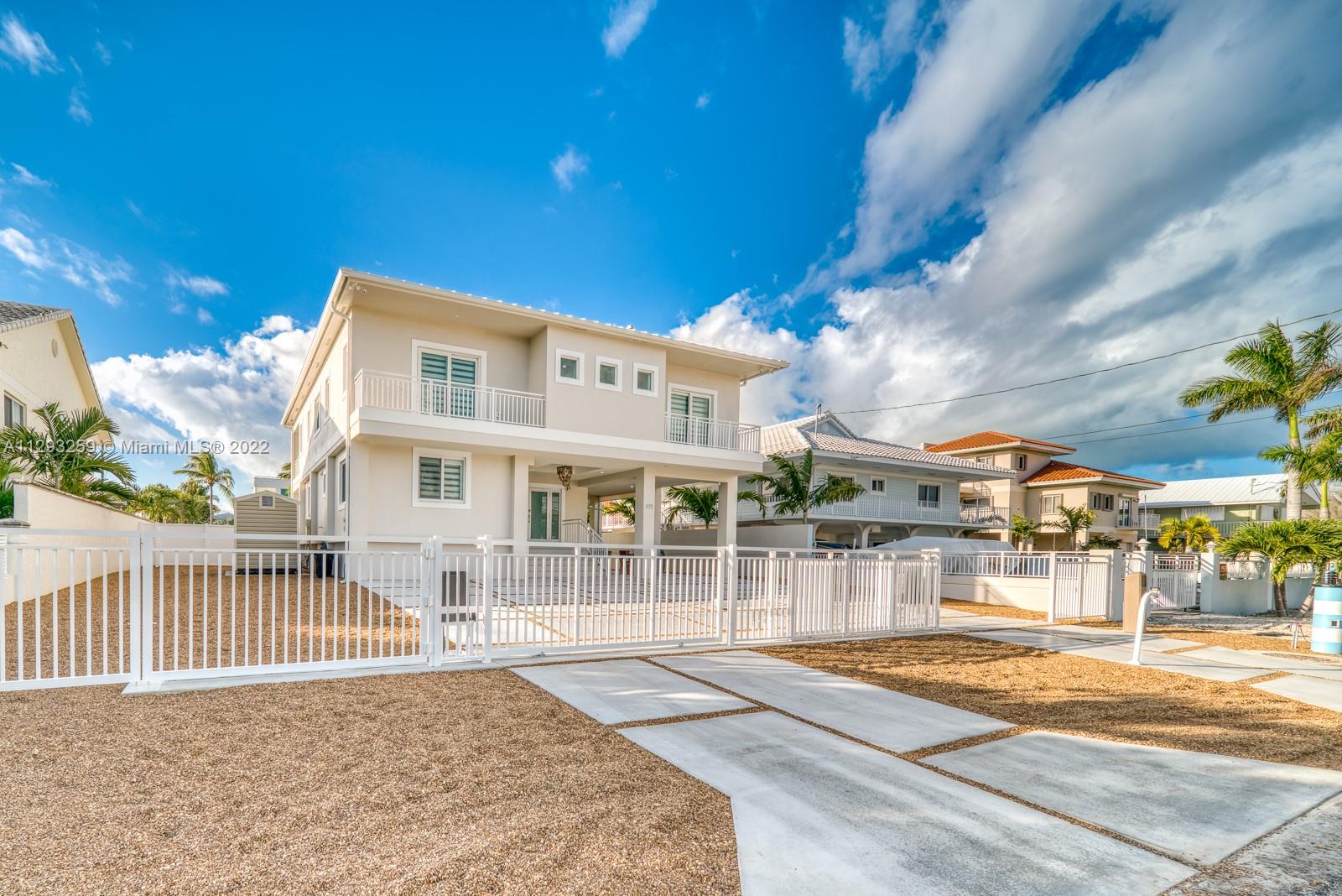 Welcome to your new and lavishly furnished luxury smart home on the ocean with views. This newly built home offers plenty.The property sits on a large lot that is fully fenced by walls on 2 sides and a double electric gate for the driveway. The pool / jacuzzi is Pentair controlled fully automated systems that allows you to set everything from water flow to lighting. The pool deck is surrounded by the very best artificial grass available, a full outdoor outdoor kitchen and terrace with a large TV allowing for a fantastic entertaining experience.