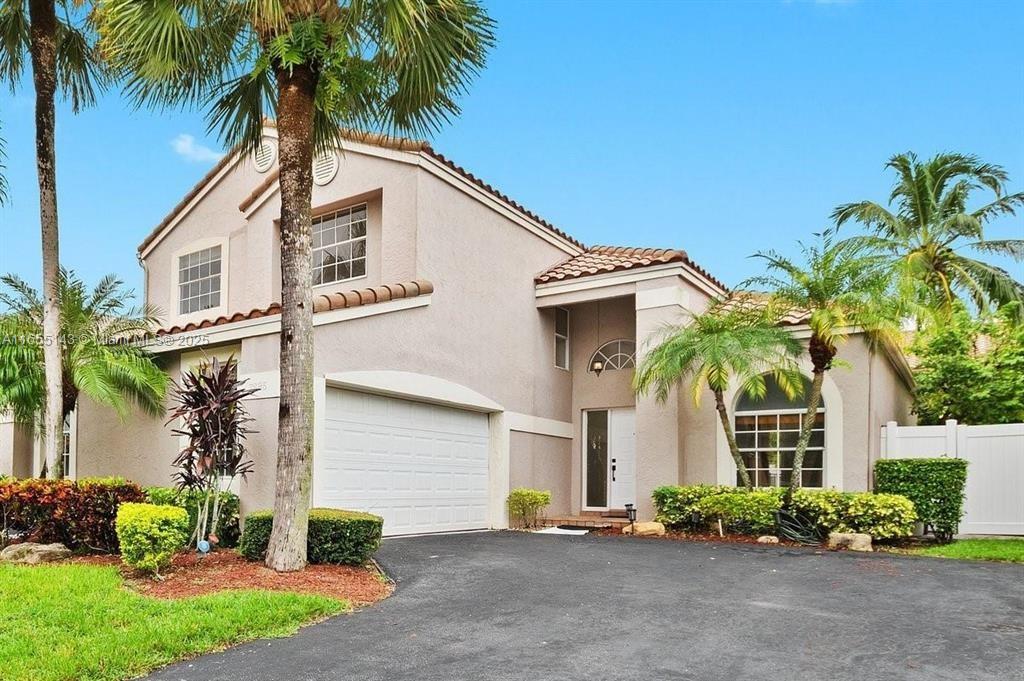 This Stunning Pool Home is situated on a Lake in desirable Parkland, it features Vaulted Ceilings in Living area, all New High Quality Vinyl Flooring throughout. Spacious Kitchen with Granite counter tops, stainelss steel appliances with an eat-in Island open to the familyroom. A large Greatroom looks out to the relaxing Pool with fountain and Waterview! Large Master Suite on the 1st floor with a large Soaking Tub, 2 walk-in closets and direct access to the pool. Upstairs are 3 spacious bedrooms and a Loft great for office or play area! New AC just put in 2024, New Pool Fence, New Washer & Dryer. Sink in gargage is newly installed. Enjoy the outside oasis, Florida living at its best! Near Parks, Dining and A rated Schools! Hurry this one won't last!
