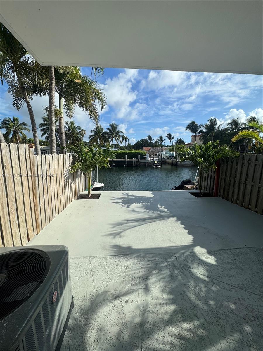 This beautiful home is in excellent condition and offers a comfortable and functional layout. It features two bedrooms, each with its own bathroom, plus a den and an additional half bath (downstairs). The kitchen is spacious and bright, perfect for those who enjoy open spaces. At the back, the patio provides direct access to the canal, offering the possibility of having your own boat (20") or jet ski, and embracing a waterfront lifestyle. The house is located at the begging of the canal. The primary bedroom has a private balcony overlooking the canal, ideal for relaxing and enjoying the surroundings. Additionally, there is small front patio that adds charm and privacy to the home.