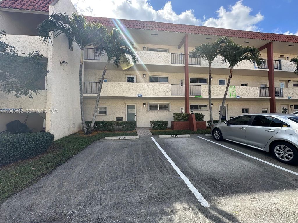 Photo of 8960 S Hollybrook Blvd #109, Pembroke Pines, FL 33025 (MLS # A11968832)