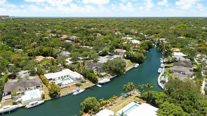 Tucked away on one of the city's most serene streets and in a prime waterfront location in Coral Gables, this remarkable property offers an unmatched living experience. With over 118 feet of waterfront and easy ocean access thru scenic Mahi Waterways, you'll be living minutes from the sea. Situated on a spacious 19,627 sq. ft. lot, the possibilities are endless. Whether you choose to renovate the existing 3,191 sq. ft. home with four bedrooms and four en-suite baths, featuring an L-shaped layout, or create your dream home from scratch, there is ample space to bring your vision to life. Perfect for boating enthusiasts eager to explore the golden waters at a moment's notice.
Sold As is.