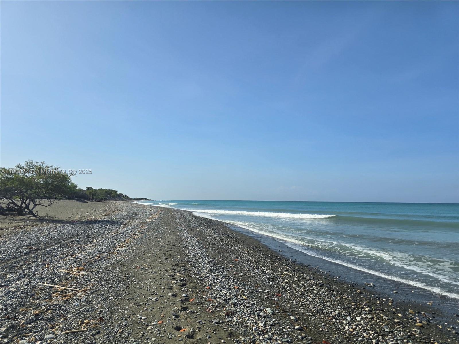 Here is an incredible opportunity to buy a huge unimproved parcel, with over 2.5 miles of gorgeous shoreline on the Caribbean Sea. The parcel is located in a protected area, right next to the natural monuments of the Dunes of Calderas. Intensive development will not be allowed on this parcel. However, permitted uses may be an ecological park much like the natural monument next to the land, or harnessing wind and wave energy from renewable natural resources. A similar path of development to Punta Cana, may be possible. Educational uses, to study the ecosystem, as the land is unspoiled. The land is difficult to access without being accompanied by someone who knows the land, as there are inhospitable thorns and bushes guarding access. The beachfront is gorgeous, on the magnificent carribbean.