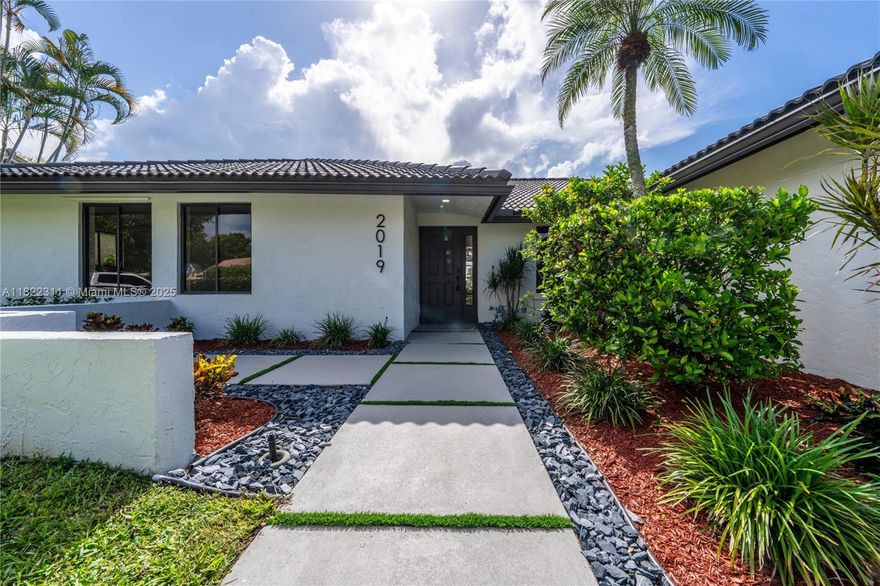 Stunning 4BD/2.5BA waterfront pool home in the heart of Coral Springs! Bright and open with soaring vaulted ceilings, sleek LED lighting, and brand-new floors throughout. The showstopper kitchen features quartz counters, stainless steel appliances, and a huge island perfect for entertaining. Designer-updated baths, custom vanities, and a spa-like primary suite with a cedar-lined closet. Freshly painted inside and out with lush new landscaping. Step outside to your private screened patio and sparkling pool with water views. No HOA! Close to A+ schools, parks, shopping, and dining. This home is a must see!