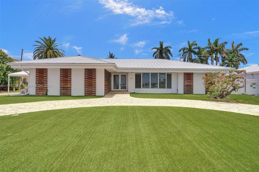 FLORIDA DREAM HOME FOR SALE!!! A 4B/3B single family home for sale in the heart of the Hollywood Beach FL. This jewel has 100 feet of shoreline. The home faces the only water sports friendly ocean access lake in south Florida. You can water ski, boat and dine on the local sand bar. This Property is in a rare double corner lot 100x125 with a new spacious private dock. The home features 4B/3B with 2,554 sf living area, solar panels, metal roof, maintenance free yard Astro turf, saltwater pool, paved circular driveway, hurricane glass windows/doors throughout, modern baths, great modern eat-in kitchen w/ stainless steel appliances, European's closets cabinetry & built-in garage cabinets and floors. The sale includes boat lift, generator, sauna, BBQ grill, and hot tub. You must come see it!