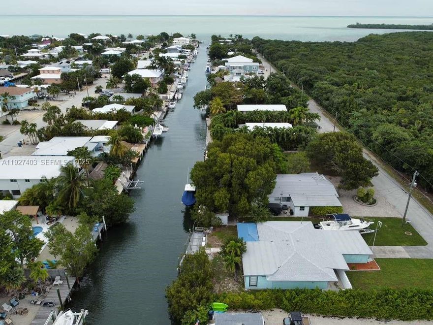 Welcome to 1403 Grouper Dr, a true Florida Keys gem located in the heart of Marathon! This charming 3-bedroom, 1-bath home offers everything you need for the ideal Keys lifestyle—whether you're looking for a primary residence, a vacation getaway, or a strong investment opportunity.

Enjoy direct ocean access from your private boat dock on a deep-water canal, perfect for boating, fishing, and exploring the world-class waters the Keys are known for. With no HOA, you have the freedom and flexibility to use the property as you choose, including potential short-term rental options.

Inside, the home is well-maintained, filled with natural light, and features an upgraded bathroom that adds a modern, comfortable touch. The layout is open and welcoming, creating an ideal space for Keys living.

Situated within a Florida Keys wildlife and environmental area, the property benefits from protected land directly in front—ensuring no future construction and preserving your privacy, views, and the natural beauty that surrounds the home.

Located just minutes from top dining, beaches, marinas, and favorite local attractions, this home puts the best of Marathon right at your fingertips.

Whether you’re seeking coastal living or a high-demand investment property, this Marathon retreat checks all the boxes. Don’t miss out on this rare waterfront opportunity!