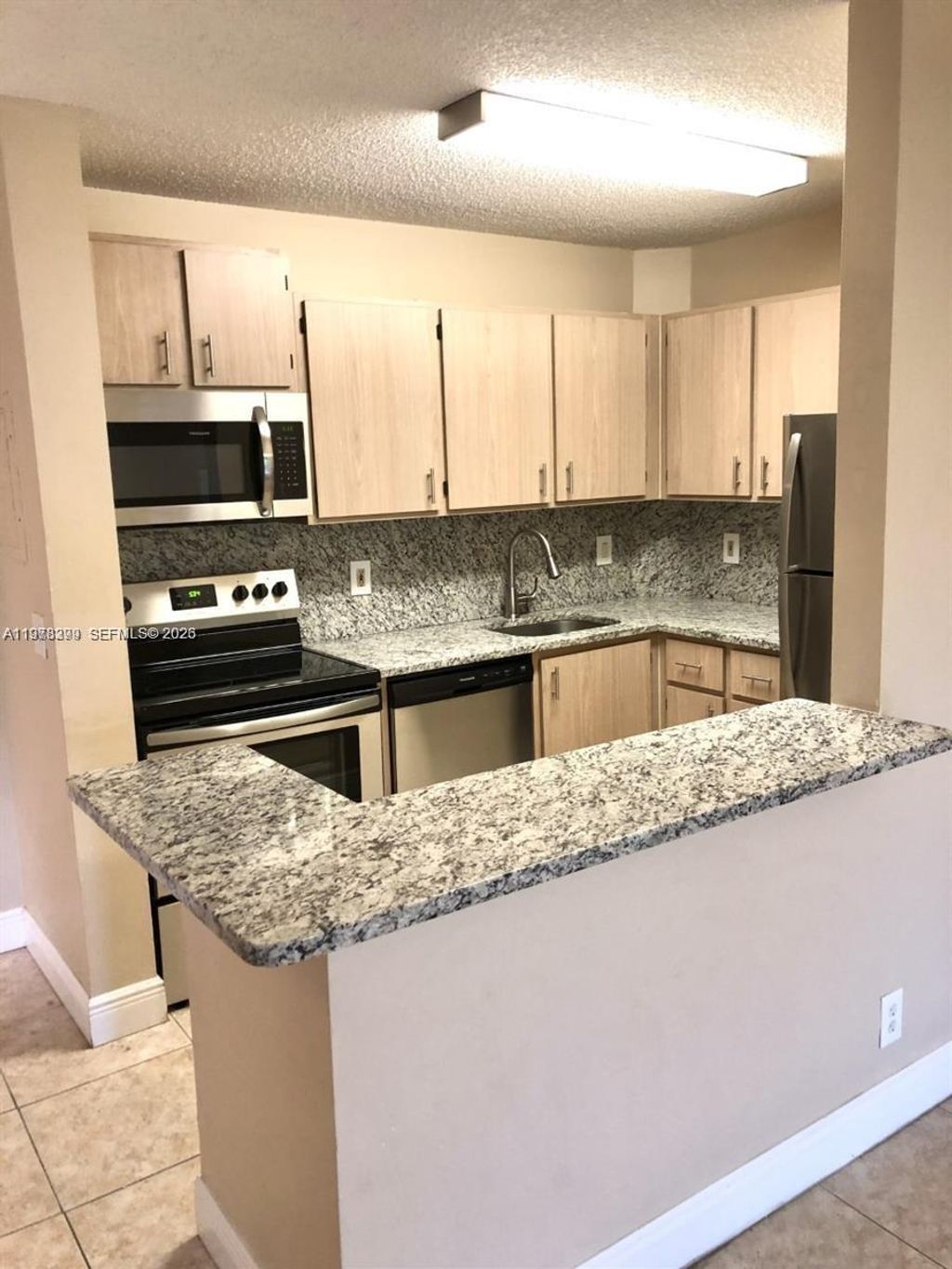 Photo of 10717 Cleary Blvd #303, Plantation, FL 33324 (MLS # A11978399)