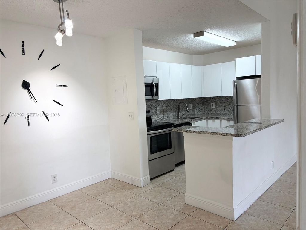 Photo of 10717 Cleary Blvd #303, Plantation, FL 33324 (MLS # A11978399)